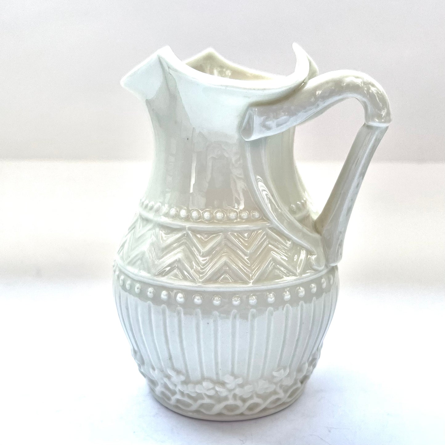 Beautiful small harp-handled milk jug in a rare design by Belleek, Second Black Mark