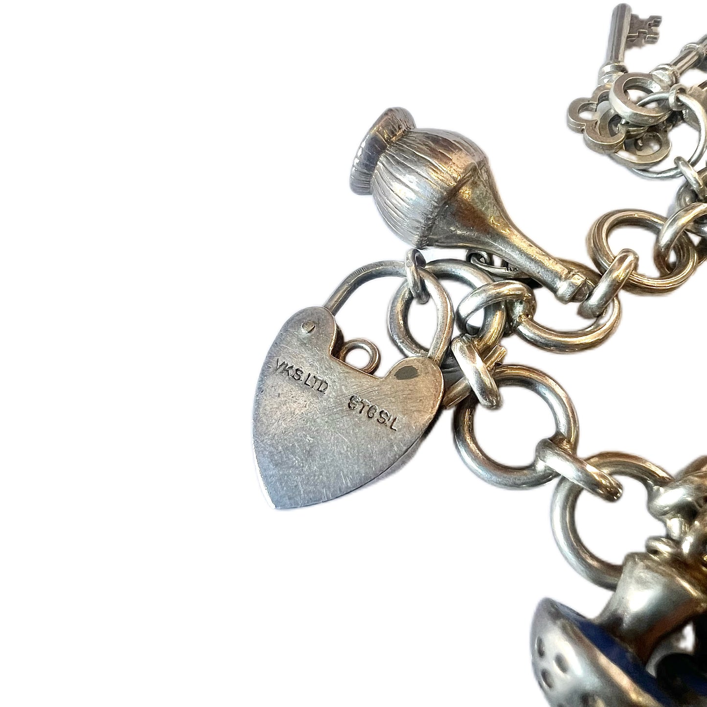 Vintage unmarked silver charm bracelet with 9 charms