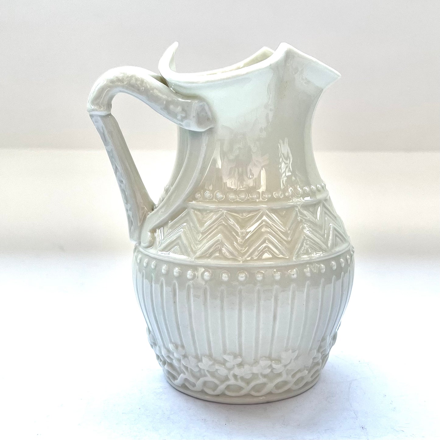 Beautiful small harp-handled milk jug in a rare design by Belleek, Second Black Mark