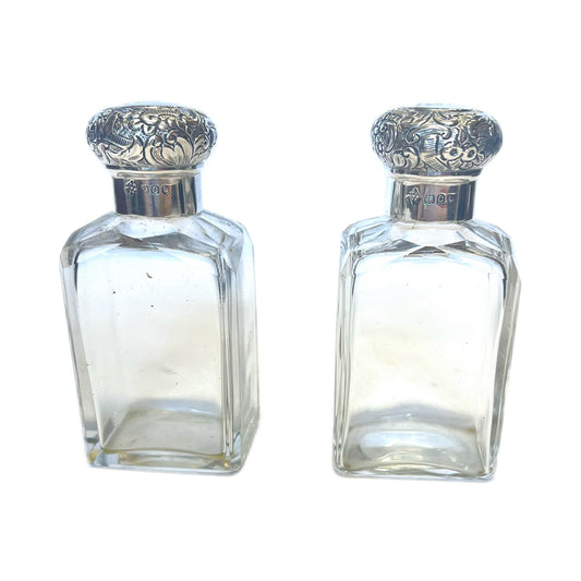 Pair of antique Victorian sterling silver and cut glass scent/toiletry bottles