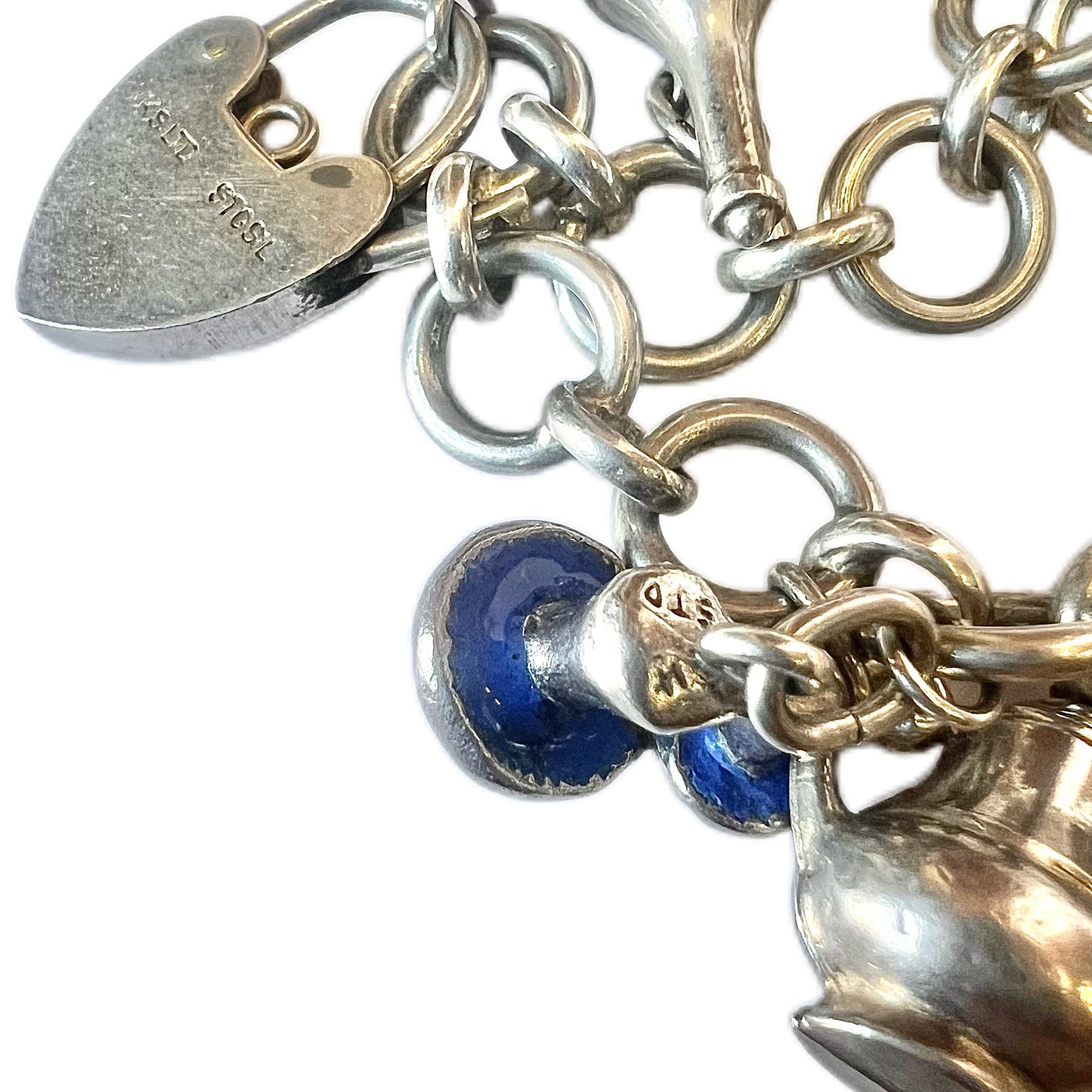 Vintage unmarked silver charm bracelet with 9 charms