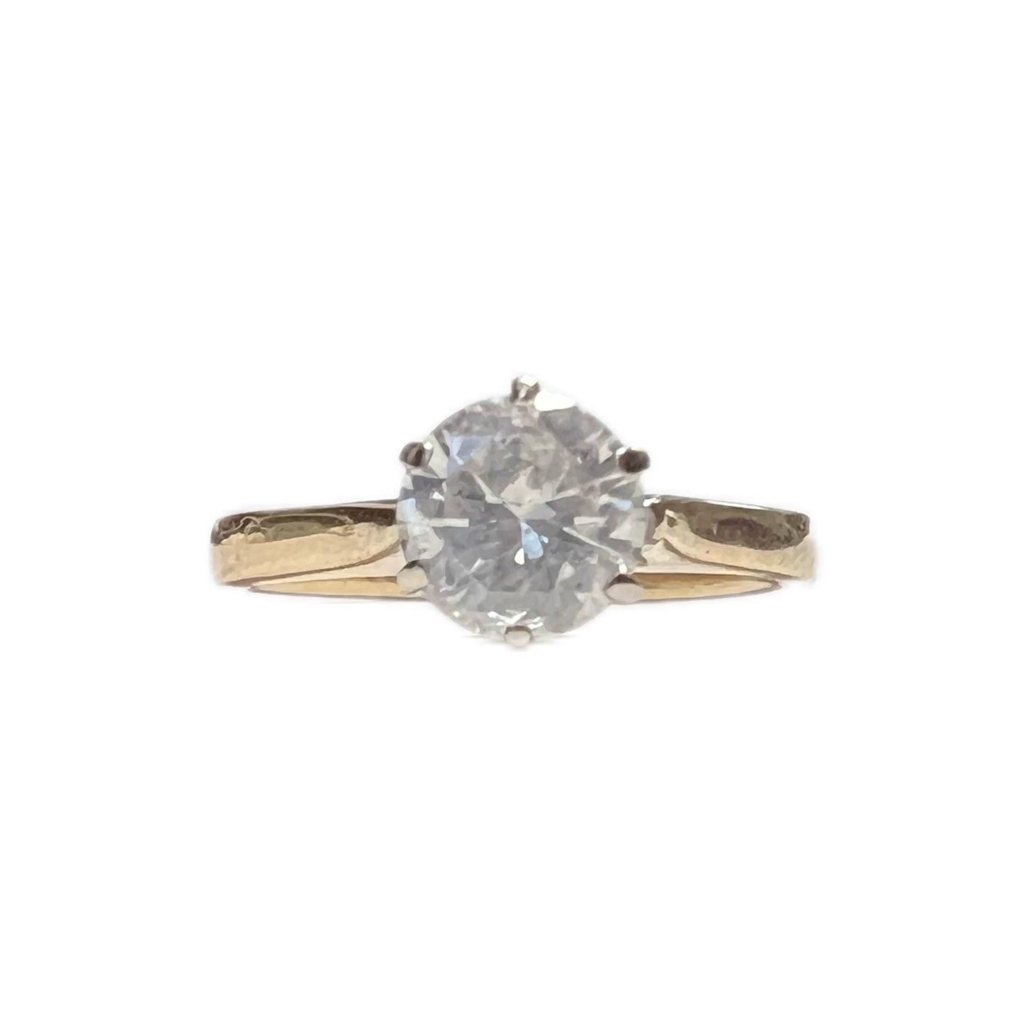 14 carat gold and round brilliant cut .08 carat diamond solitaire ring