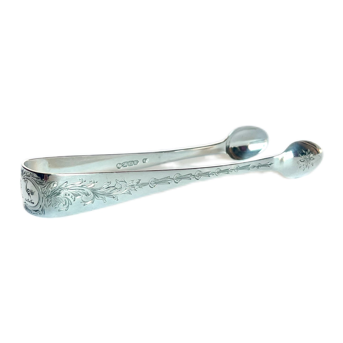 Crested High Victorian Irish sterling silver sugar tongs, Dublin 1867