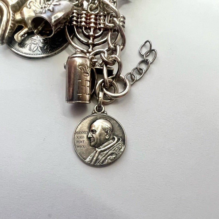 Vintage sterling silver bracelet with 20 attached silver charms