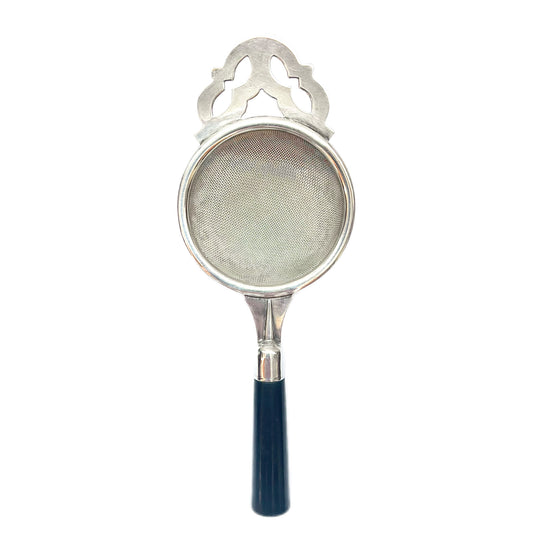 English Art Deco tea strainer with early celluloid handle