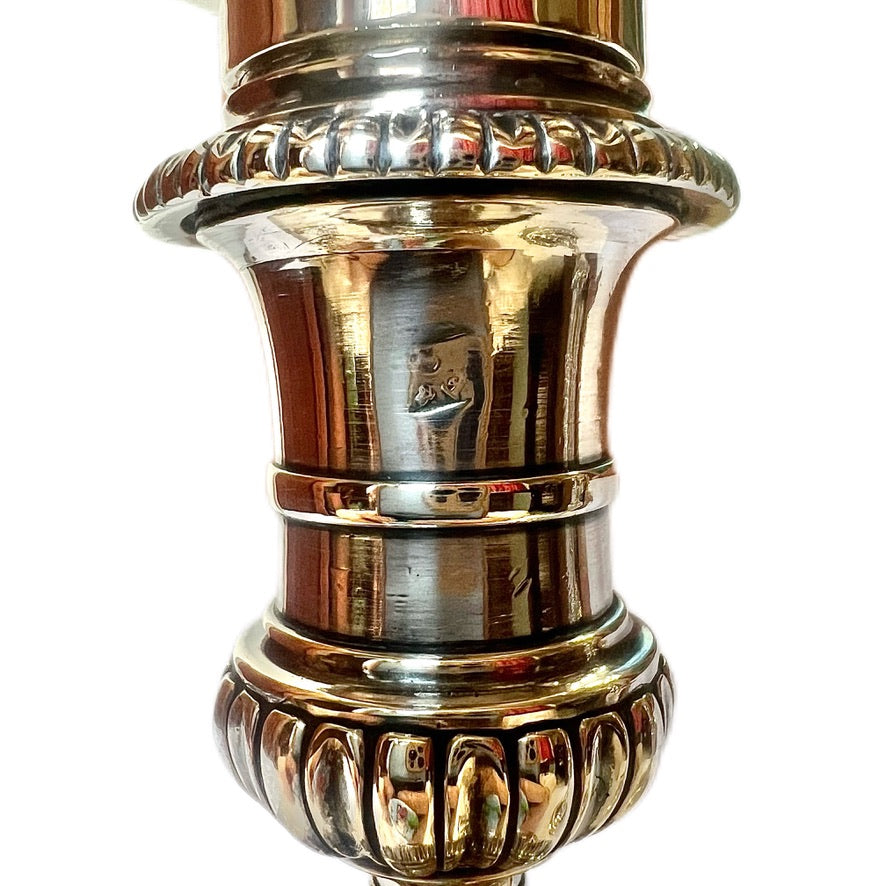Crested pair of George II sterling silver candlesticks by Elizabeth Godfrey