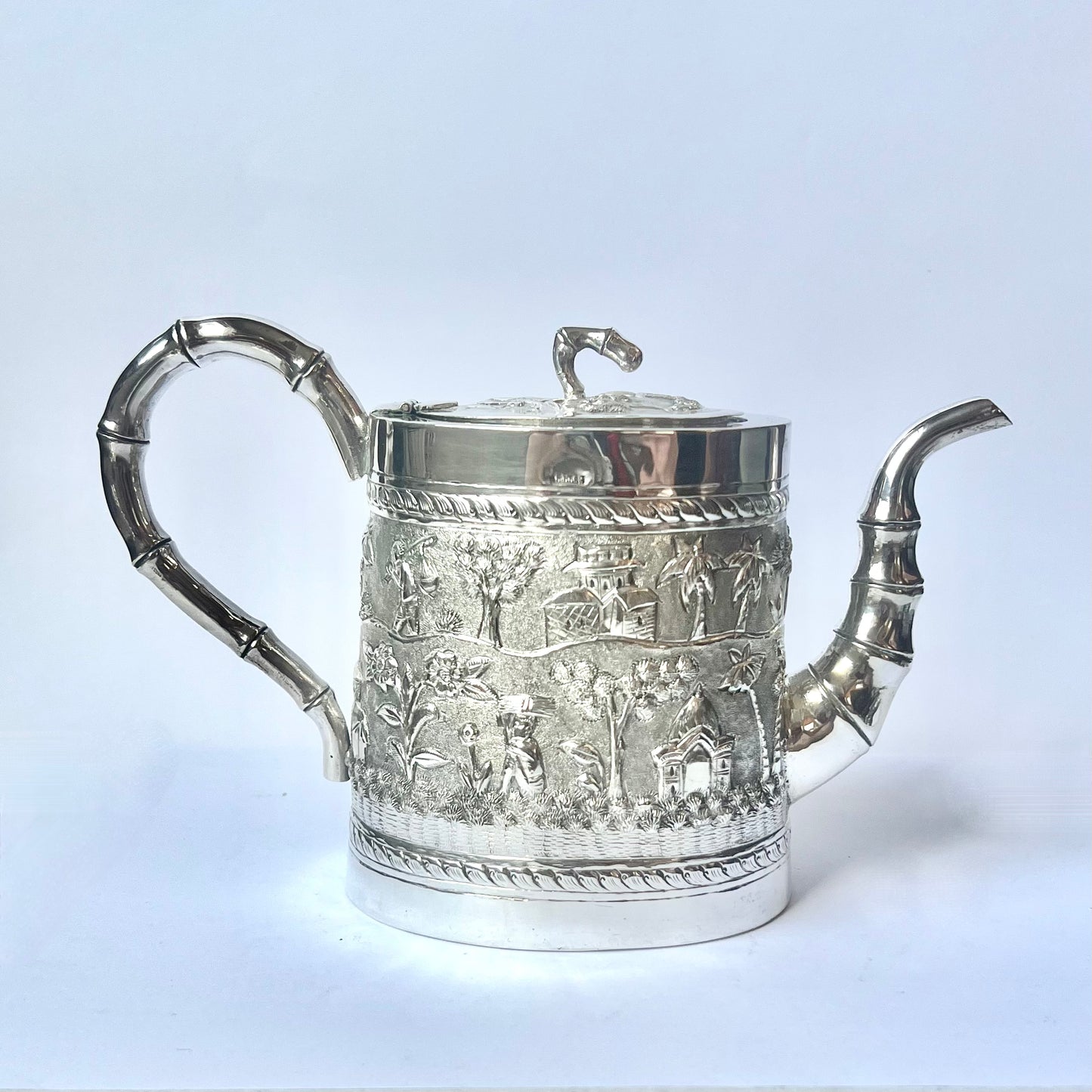 Late Victorian to Edwardian period Anglo-Indian Calcutta silver tea set comprising teapot, sugar bowl and creamer jug