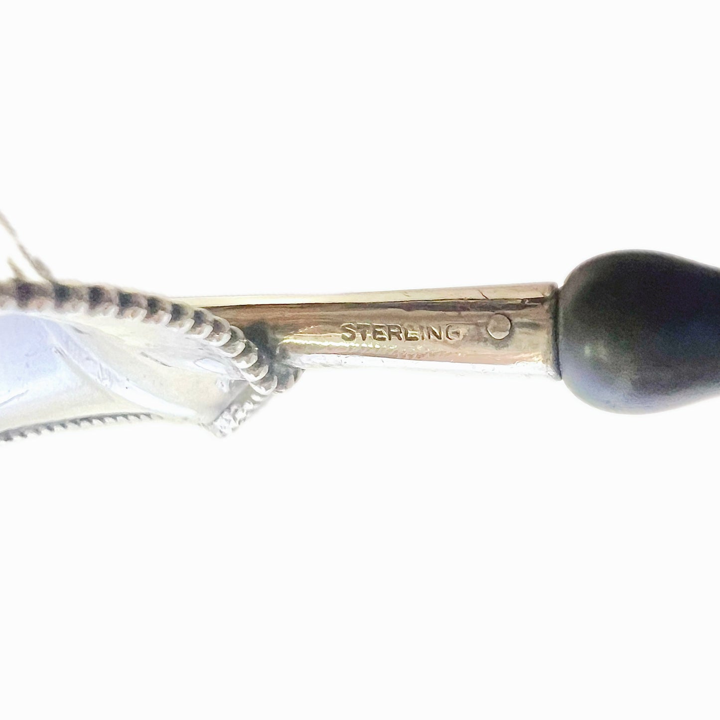 Vintage sterling silver tea strainer with ebonized timber handle