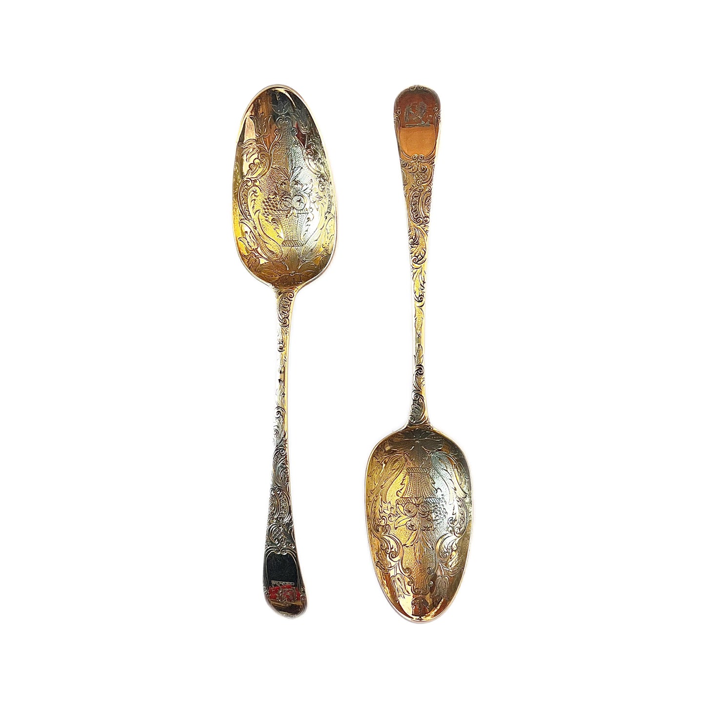 A cased pair of George III antique gilt sterling silver berry spoons, 1782, William Cattel