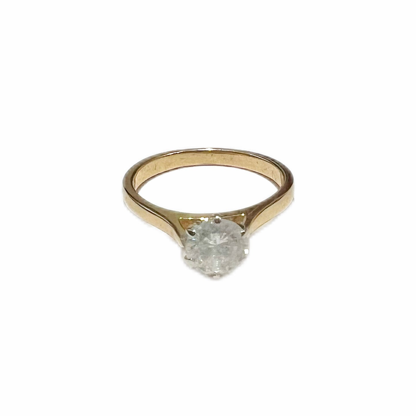 14 carat gold and round brilliant cut .08 carat diamond solitaire ring