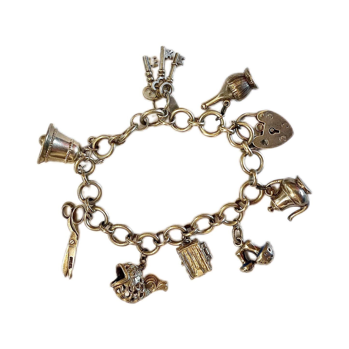 Vintage unmarked silver charm bracelet with 9 charms