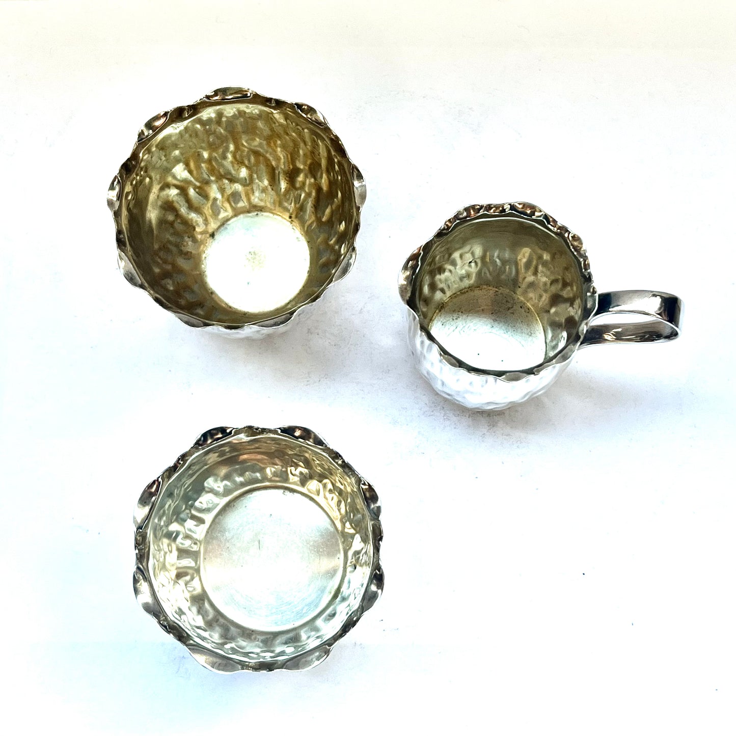 Antique silver-plated bachelor’s tea set circa 1900, comprising of small tea pot, creamer jug, sugar bowl and tea cup