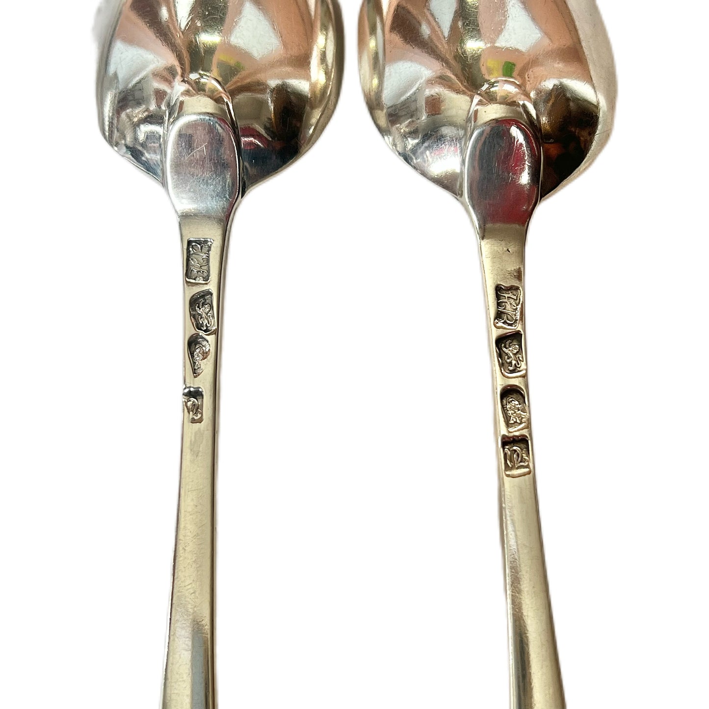 Matching pair of crested George III sterling silver serving spoons by Hester Bateman
