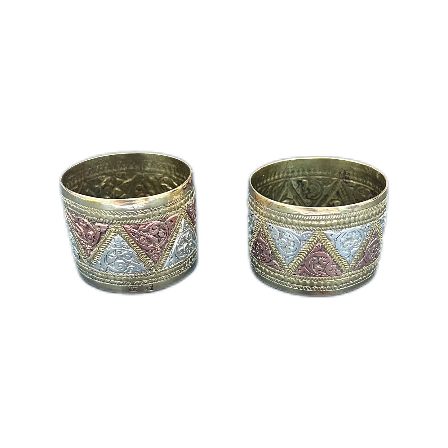 Pair of vintage Indian napkin rings in brass, copper and white metal