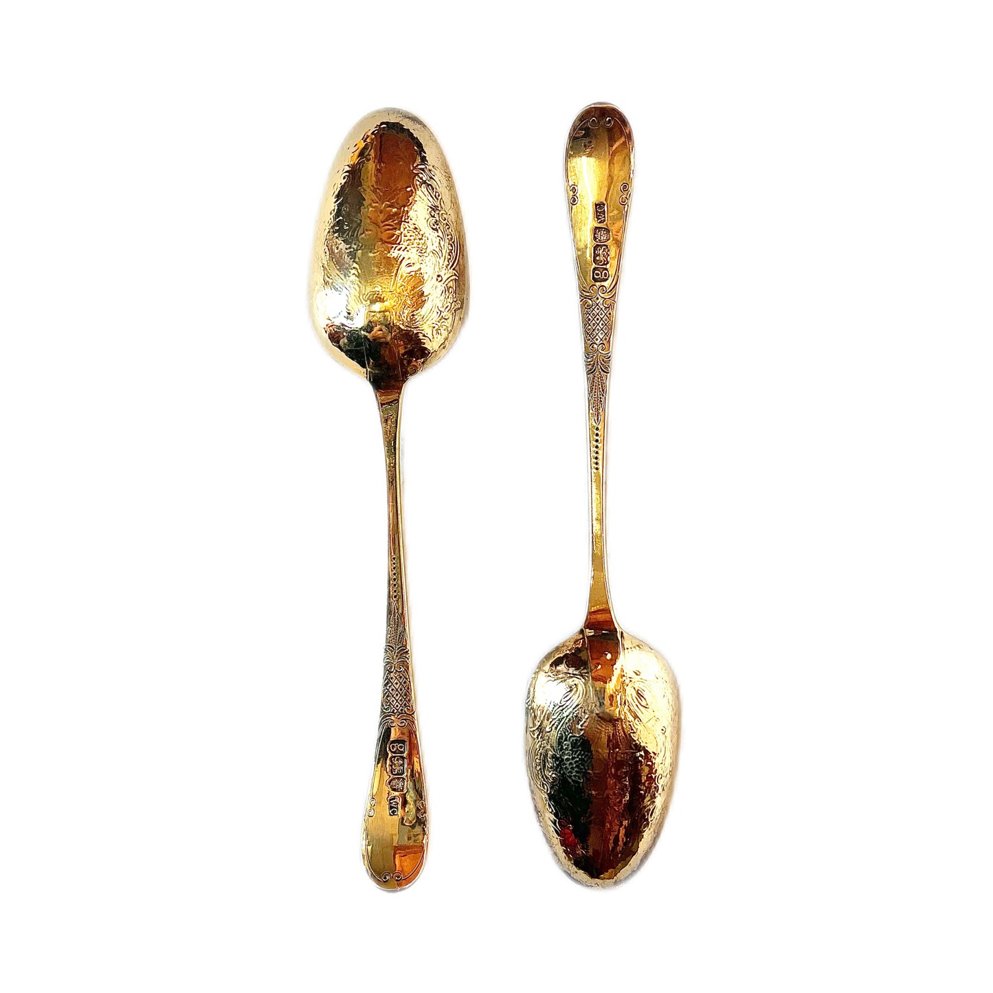 A cased pair of George III antique gilt sterling silver berry spoons, 1782, William Cattel
