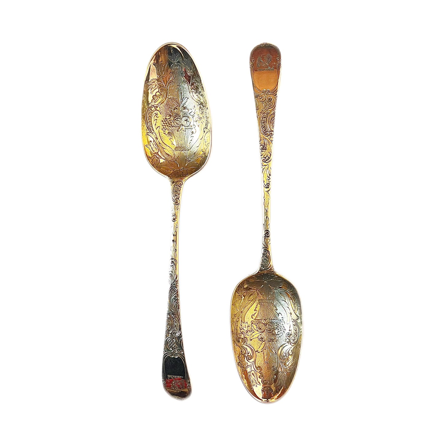 A cased pair of George III antique gilt sterling silver berry spoons, 1782, William Cattel