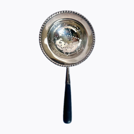 George V sterling silver and ebony-handled tea strainer