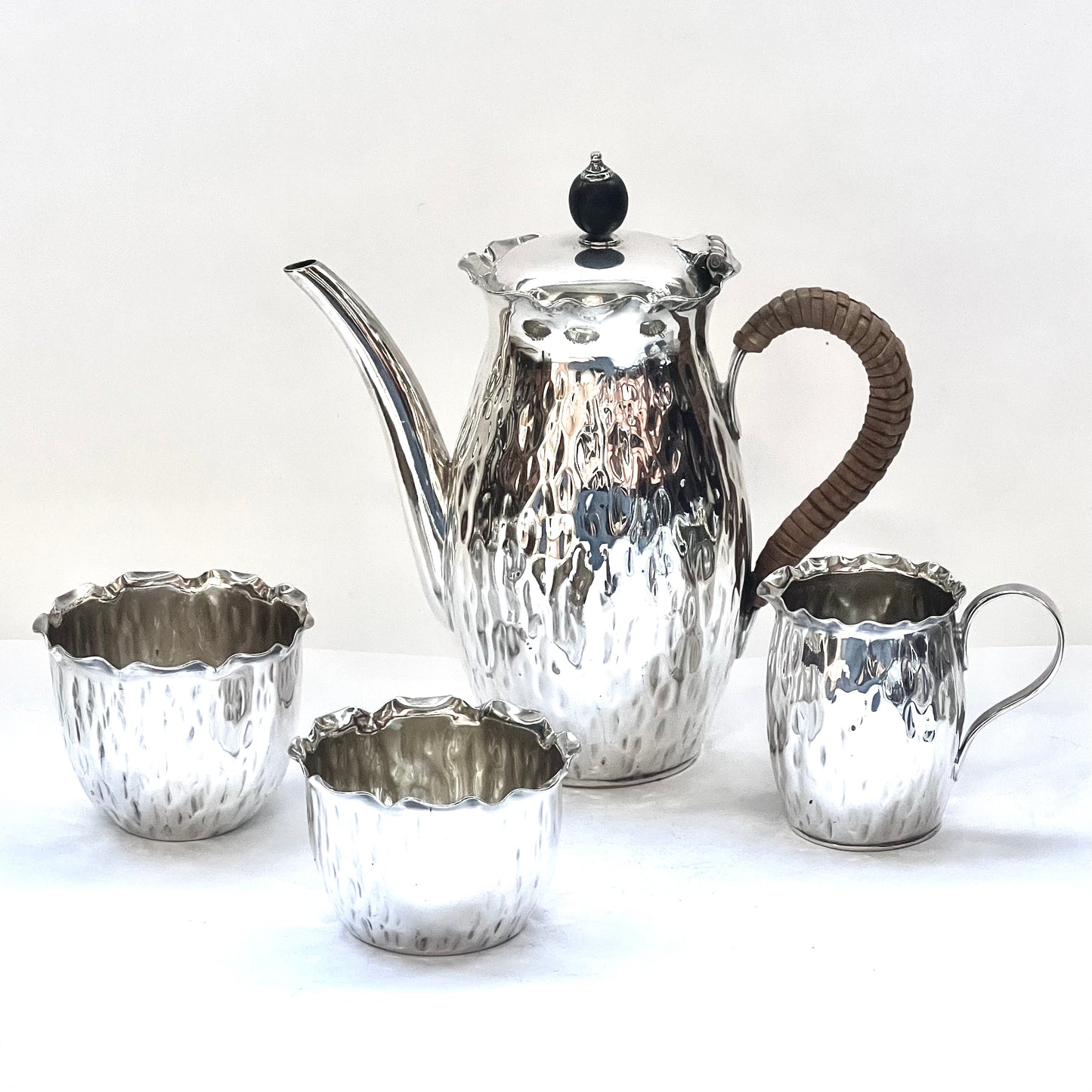 Antique silver-plated bachelor’s tea set circa 1900, comprising of small tea pot, creamer jug, sugar bowl and tea cup