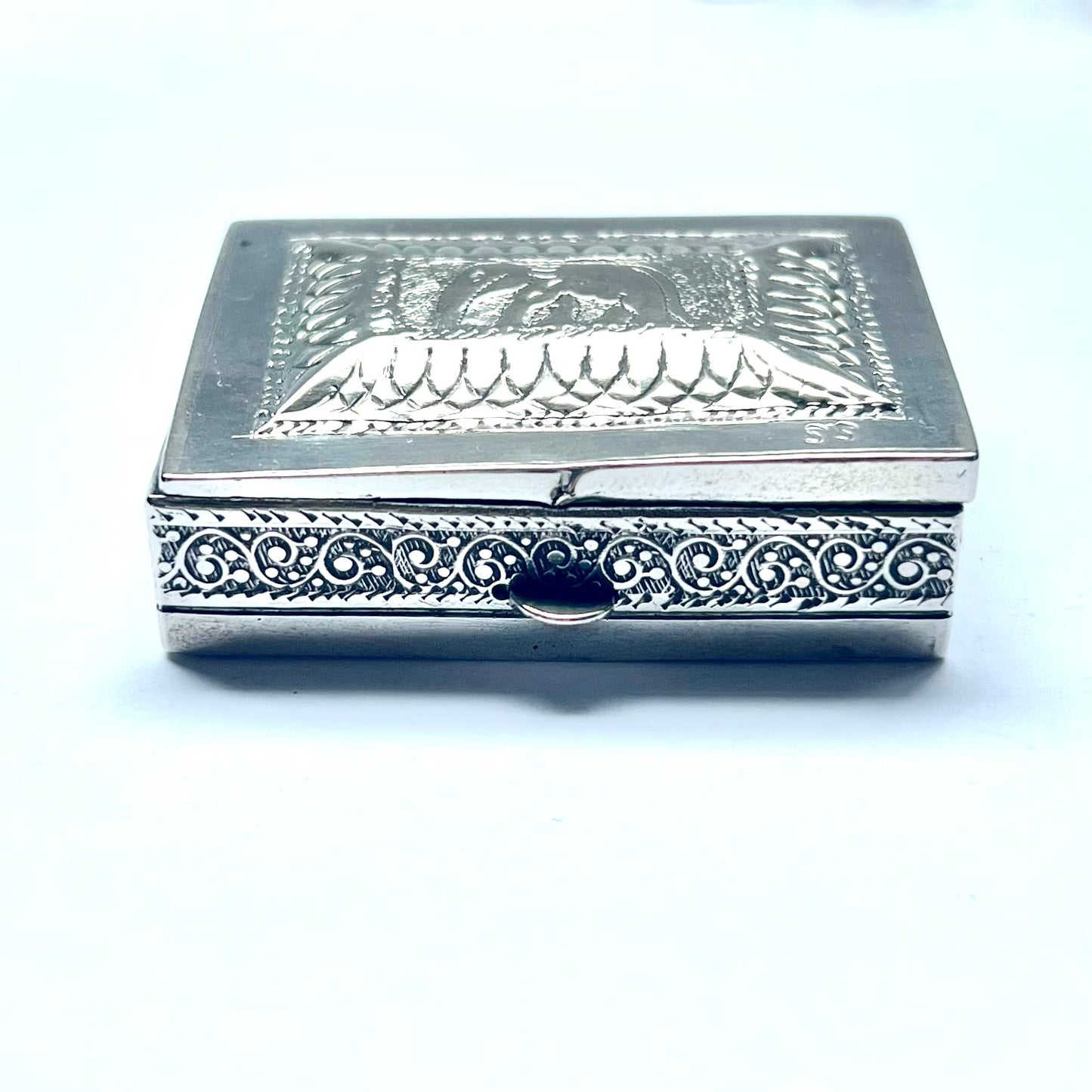 Vintage 20th century Anglo-Indian silver box between .800 to .900 silver purity, spring-loaded ashtray mechanism