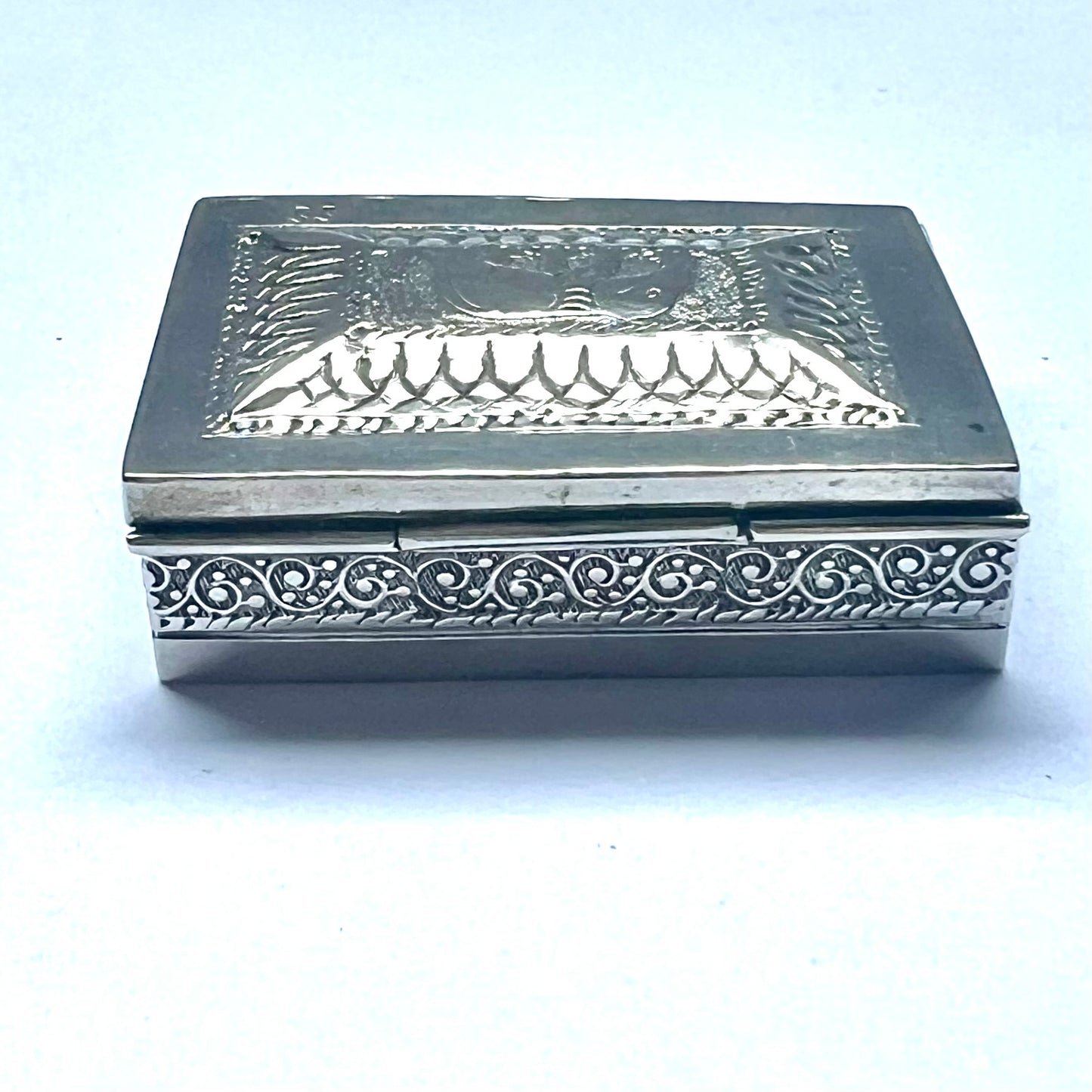 Vintage 20th century Anglo-Indian silver box between .800 to .900 silver purity, spring-loaded ashtray mechanism