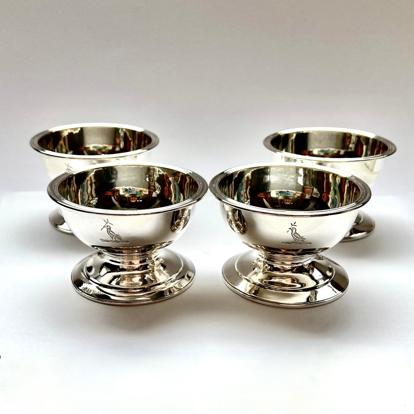 Set of 4 substantial Georgian crested sterling salt cellars, marks for Rebecca Emes & Edward Barnard 1, London, 1822.