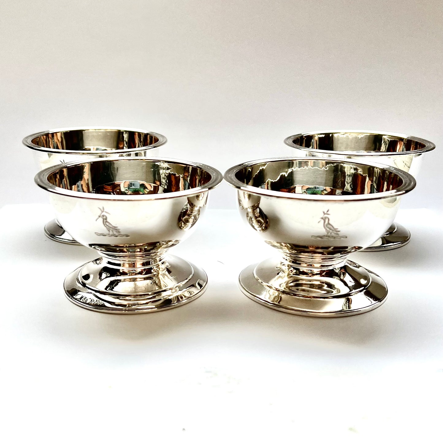 Set of 4 substantial Georgian crested sterling salt cellars, marks for Rebecca Emes & Edward Barnard 1, London, 1822.