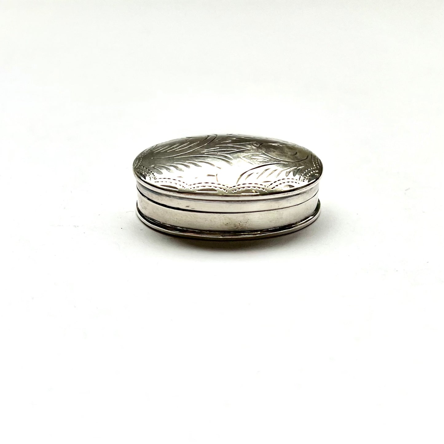 Vintage vintage oval sterling silver pillbox, foliate pattern. English import marks for Mark Houghton, Sheffield, 1993