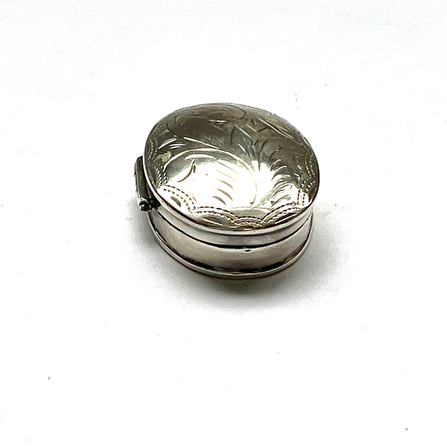 Vintage vintage oval sterling silver pillbox, foliate pattern. English import marks for Mark Houghton, Sheffield, 1993