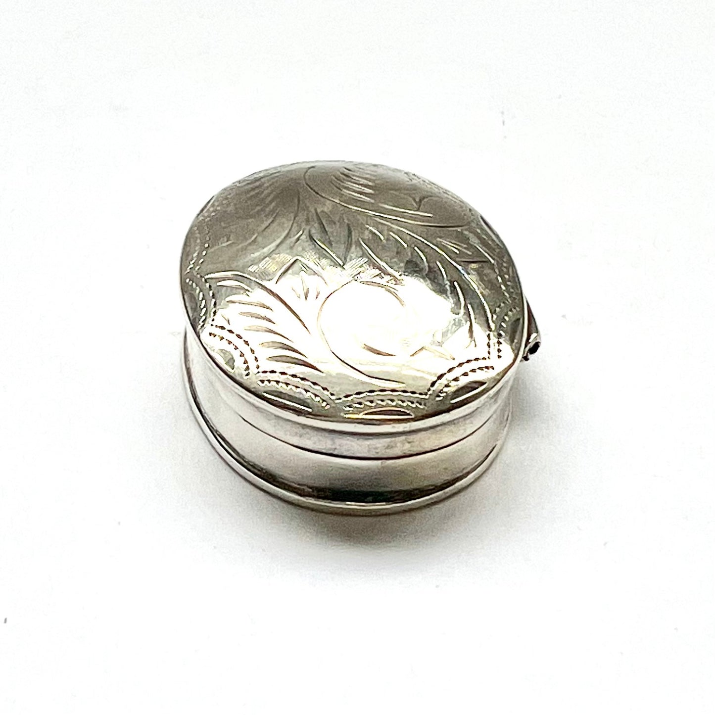 Vintage vintage oval sterling silver pillbox, foliate pattern. English import marks for Mark Houghton, Sheffield, 1993