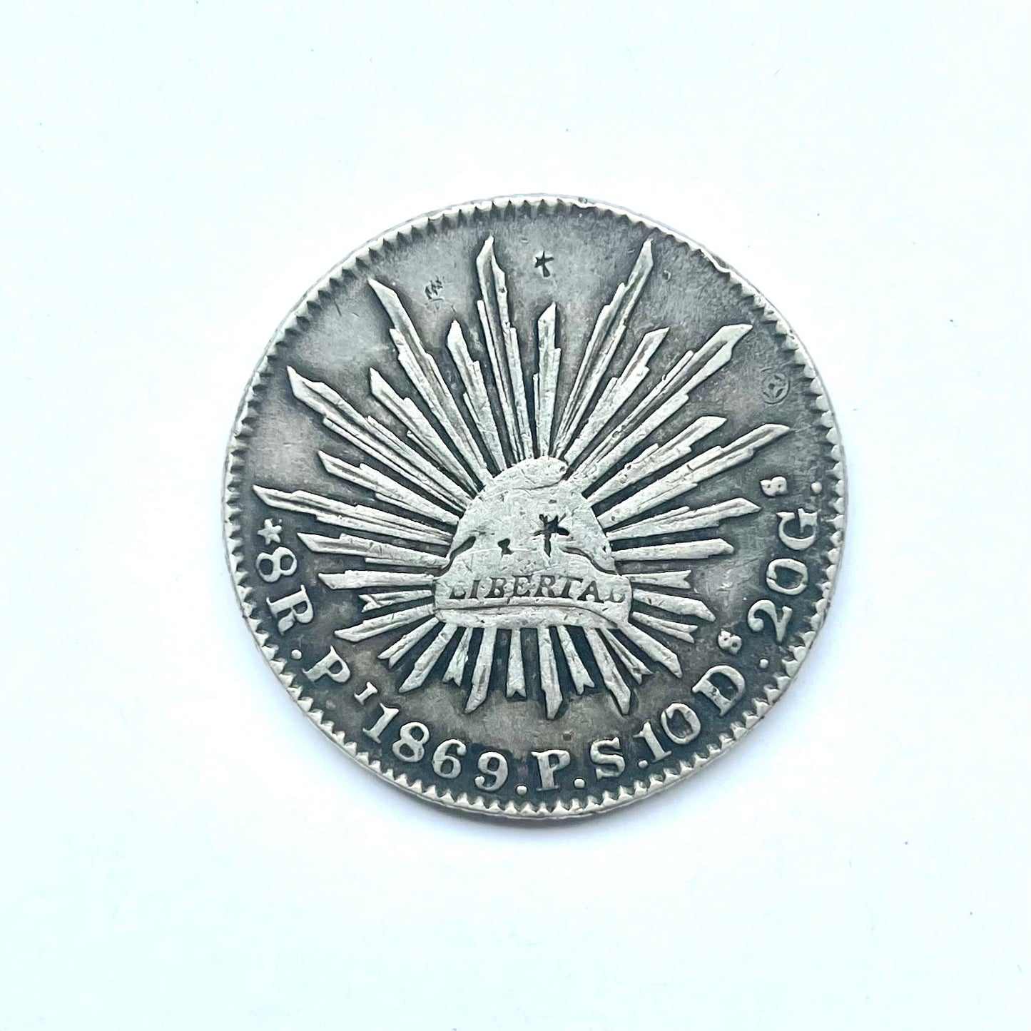 Antique Chinese chopmarked Mexican Republic Libertad Cap and Rays Silver 8 Reales coin issued by the San Luis Potosi Mint circa 1869