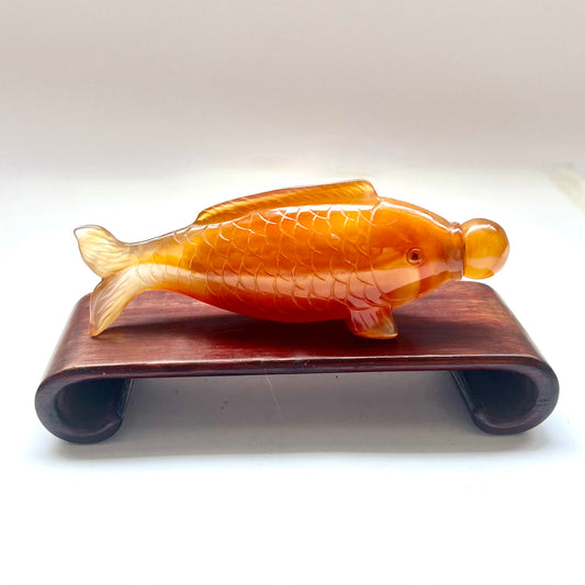 20th century Chinese orange-red agate fish-form snuff bottle