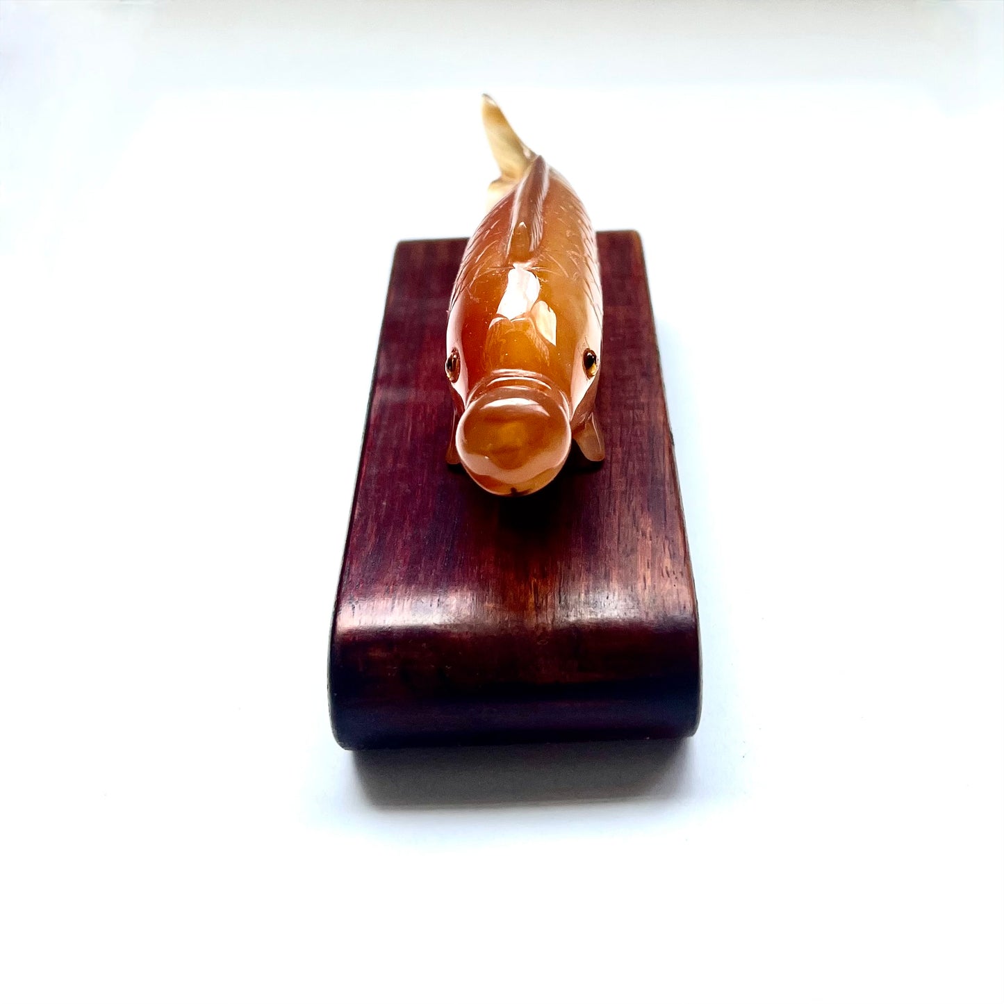 20th century Chinese orange-red agate fish-form snuff bottle