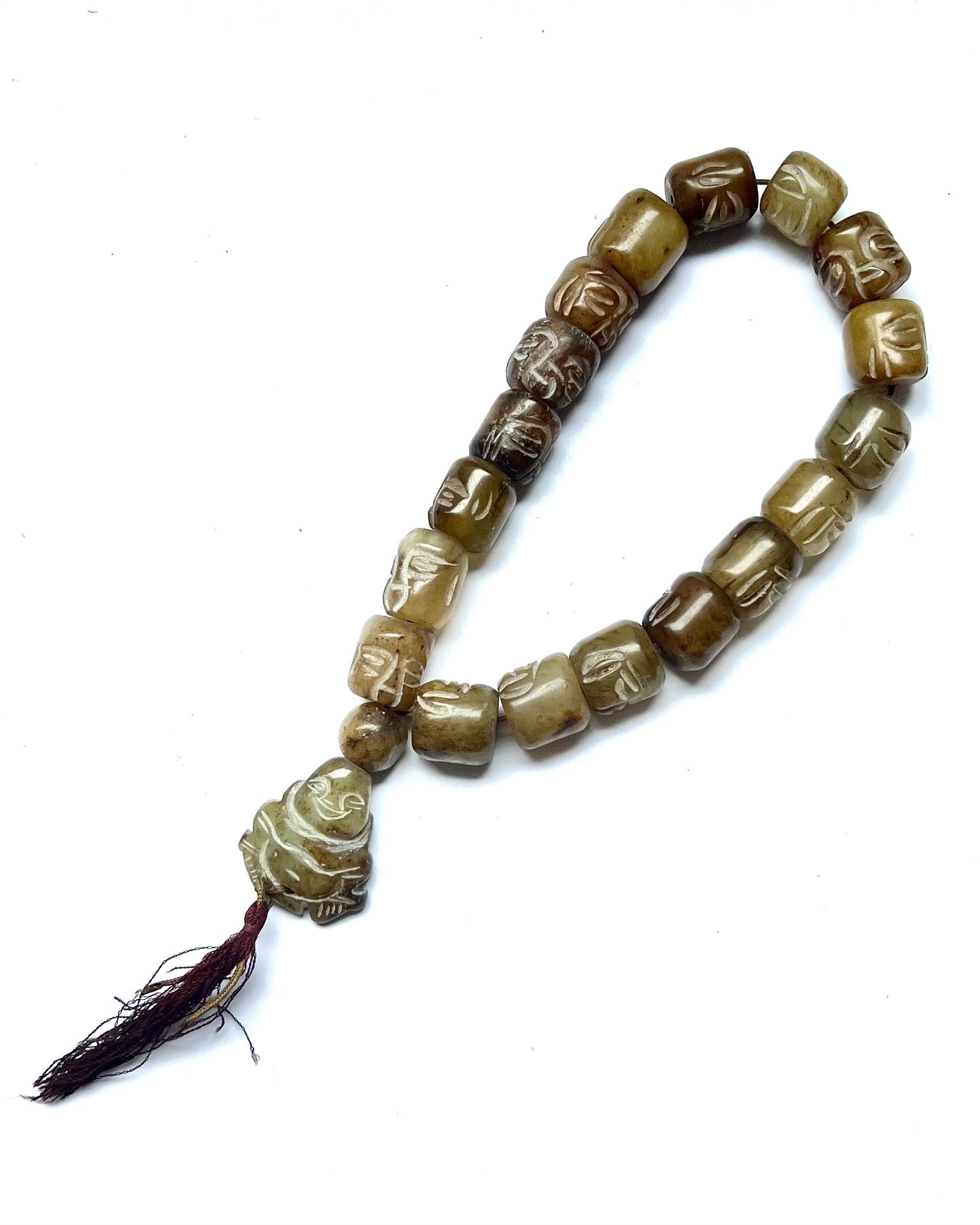 Vintage 20th century strand of green hardstone worry beads, face beads and Buddha plaque.