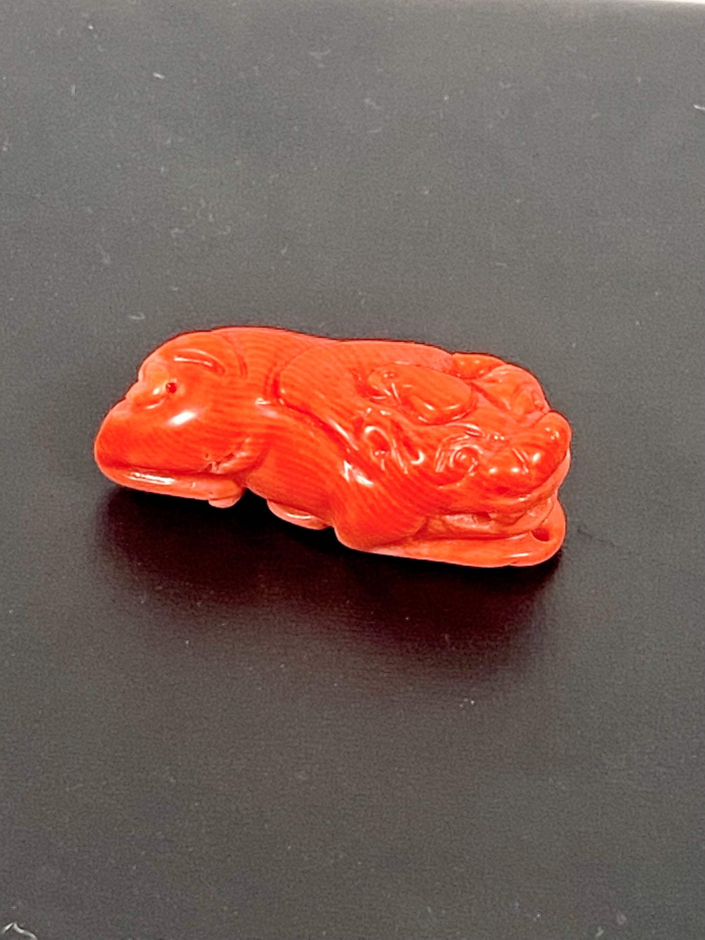 Midcentury Chinese carved coral Foo Lion or Dog Pendant