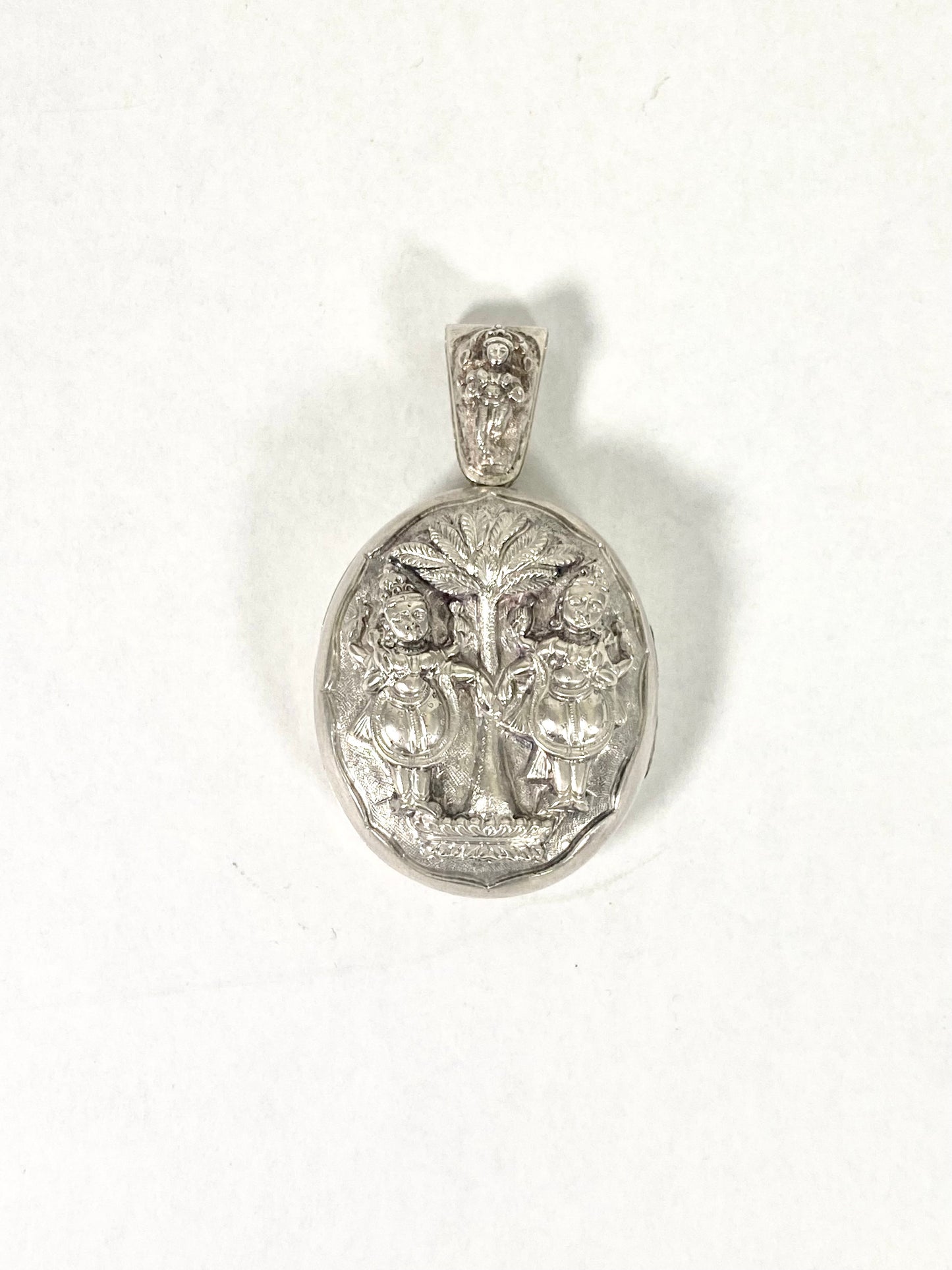 Late 19th century Anglo-Indian locket with Twin Deity and Palm Tree Motif, .800 to .900 silver, Swami Ware