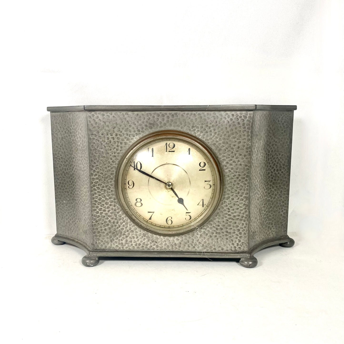 Tudric pewter clock by Liberty & Co.