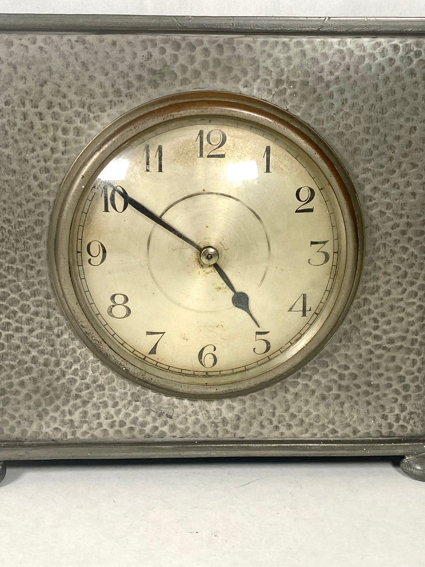 Tudric pewter clock by Liberty & Co.