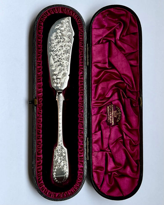 late Victorian silver butter knife beautifully engraved with a foliate pattern of ferns and ivy, Marks for James Wakely and Frank Clarke Wheeler, London 1890.