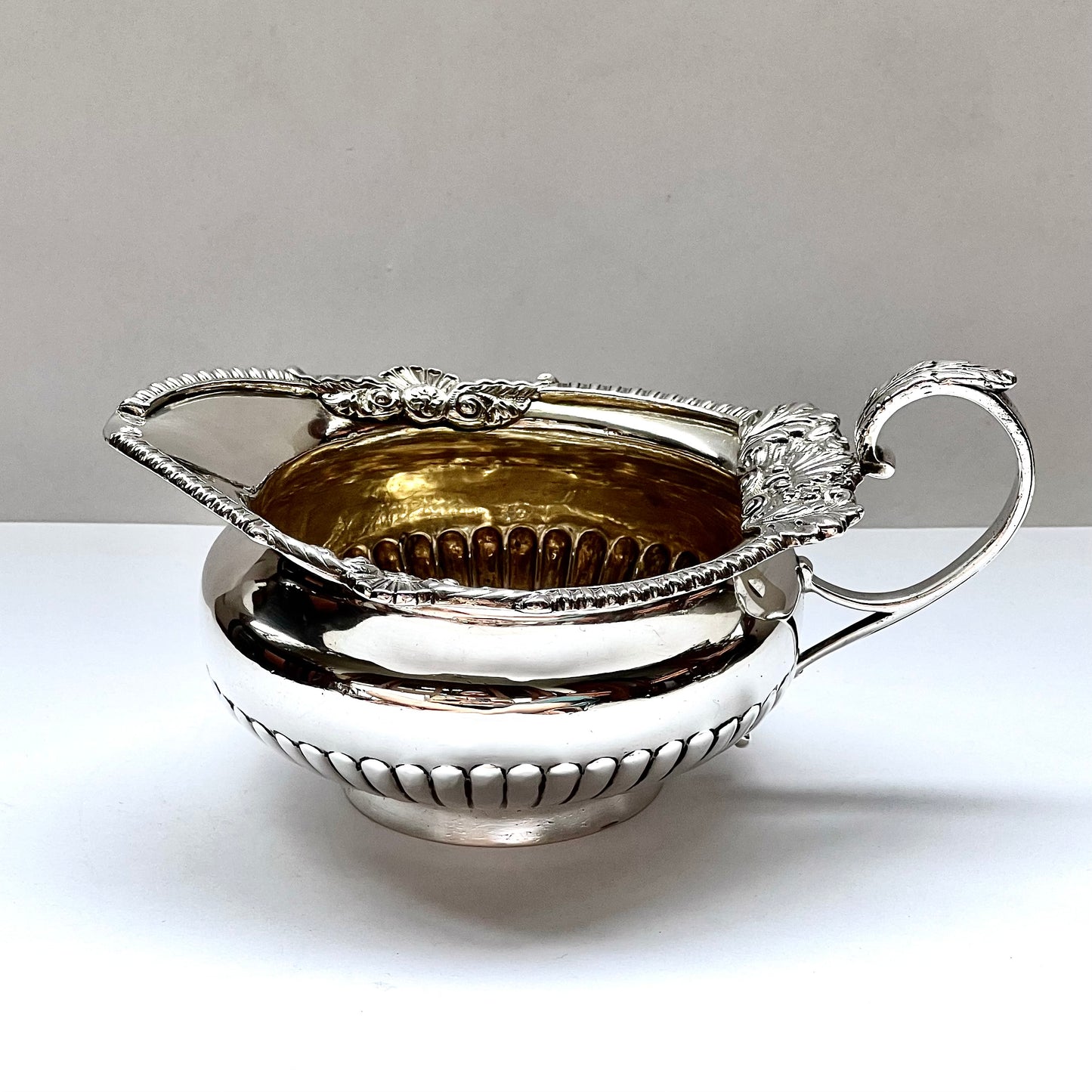 Antique late Victorian crested sterling silver creamer jug, Walter and John Barnard, London, 1888.