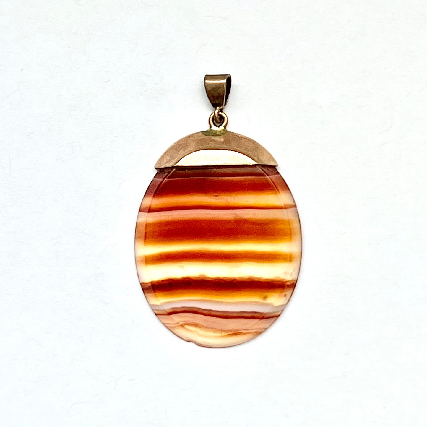 Edwardian banded agate slice pendant in 9ct rose gold setting