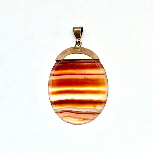 Edwardian banded agate slice pendant in 9ct rose gold setting