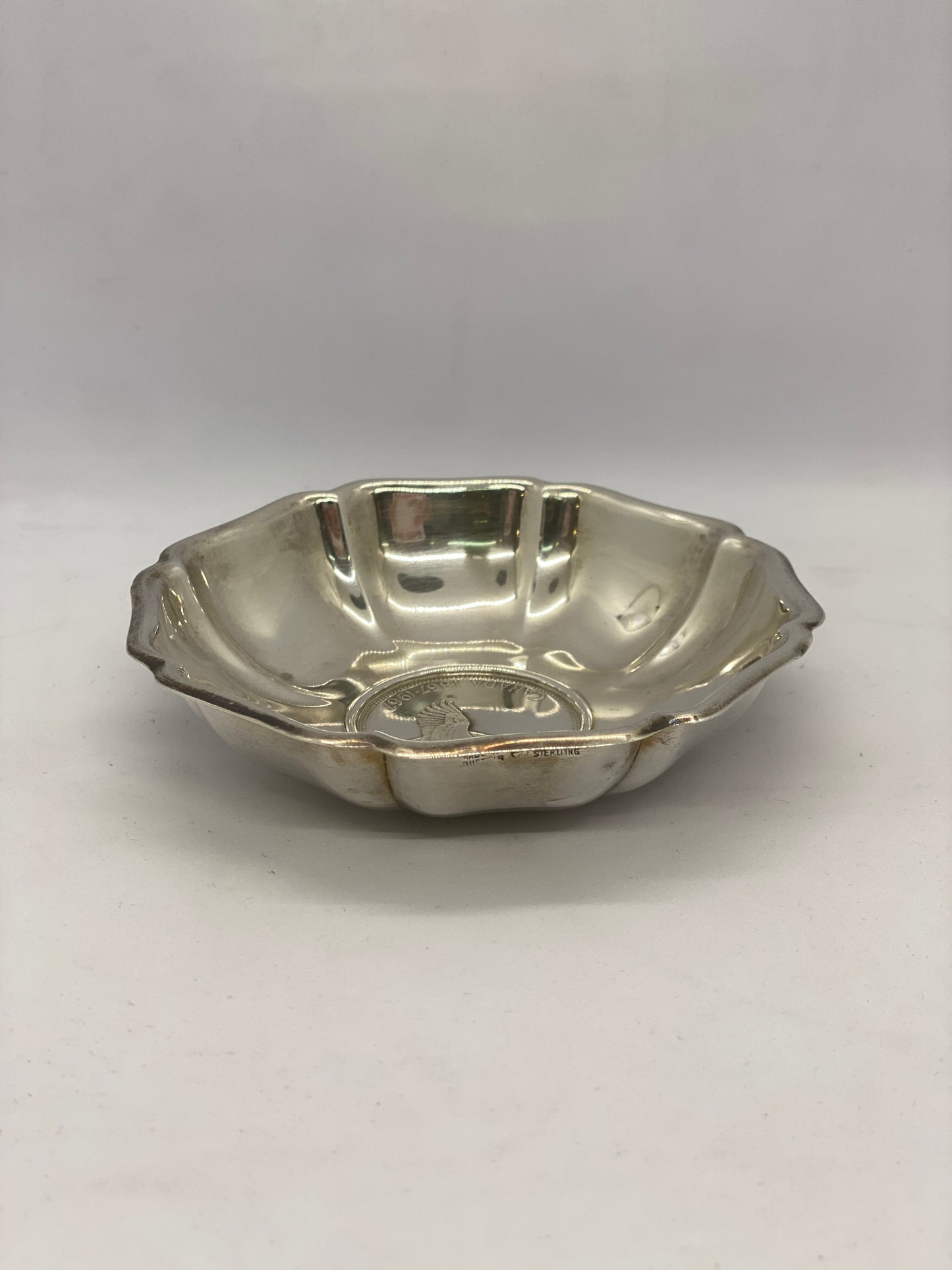 Beautiful sterling silver dish with Canadian 800 silver dollar base