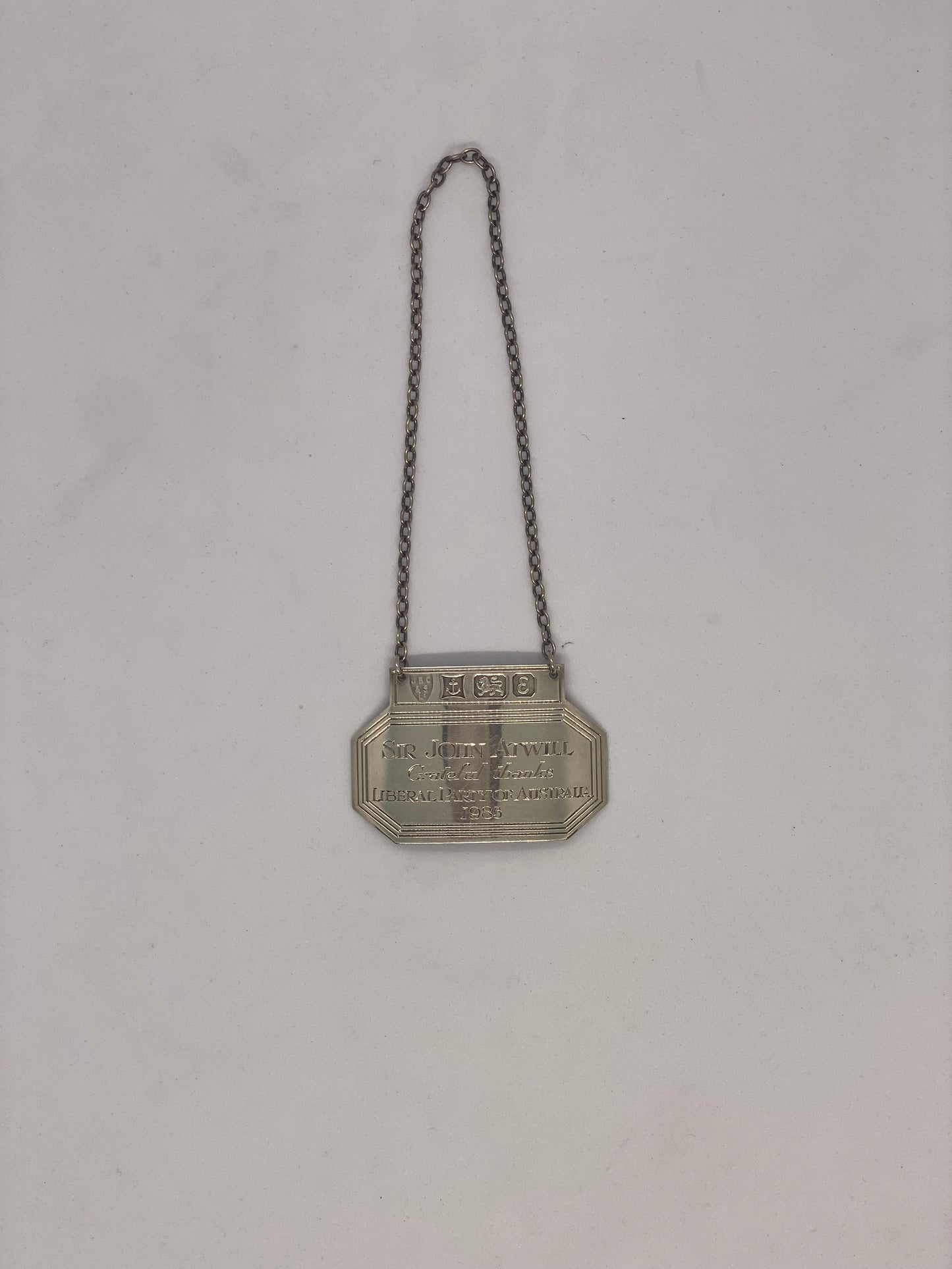 1979 Sterling silver Liquor Tag ex. personal collection of Sir John Atwill