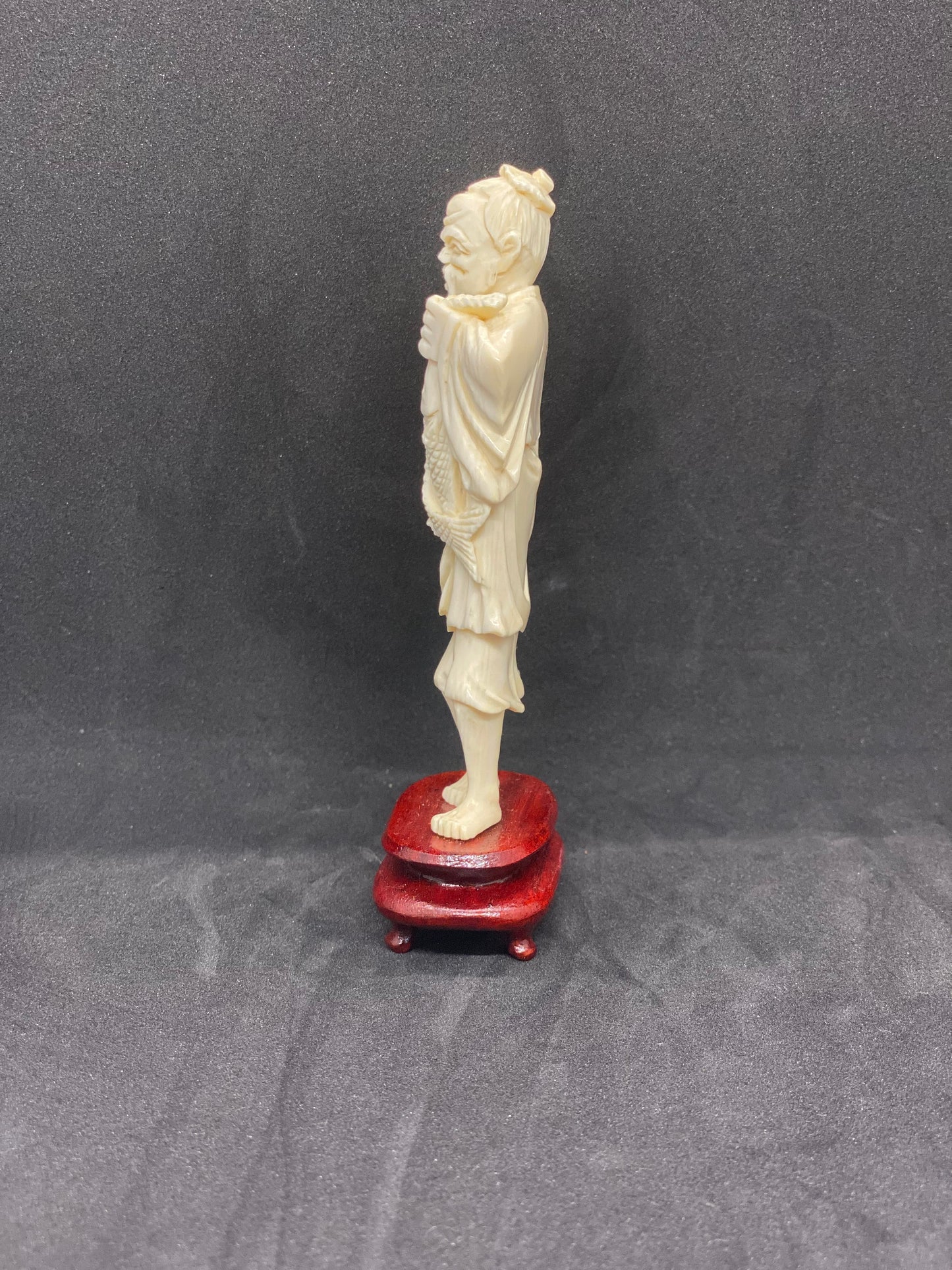 Antique Ivory Fisherman holding fish