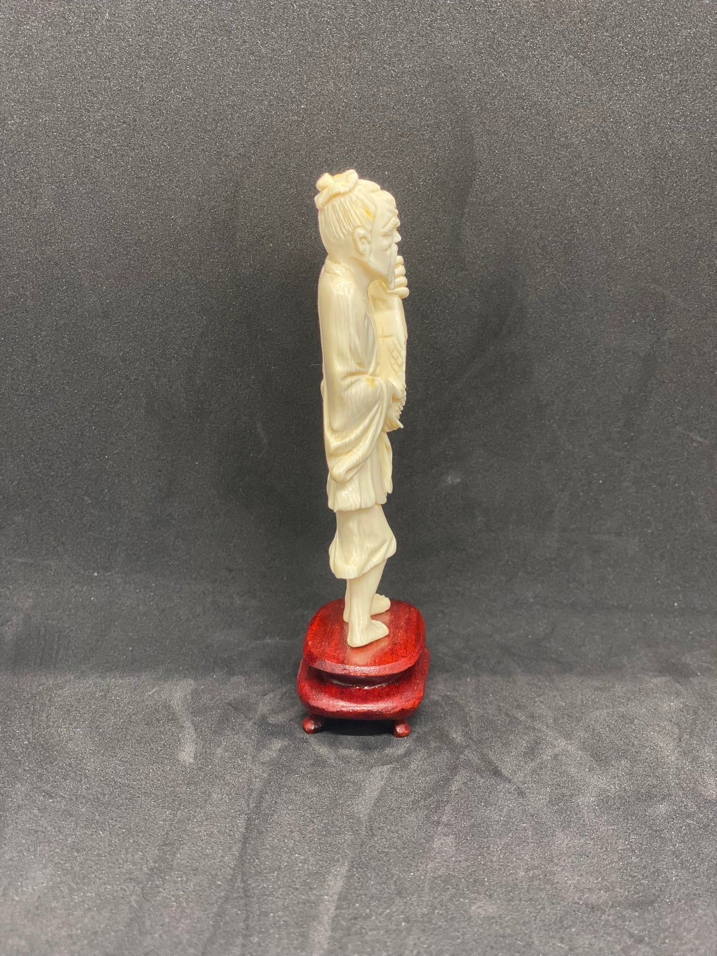 Antique Ivory Fisherman holding fish